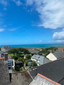 a view of the ocean from the roof of a house at The Top House Inn in Lizard +18 photos