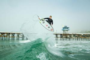 a man riding a wave on a surfboard in the ocean at San Clemente Surf Inn in San Clemente