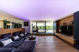 a living room with a couch and a table at Eifelvilla Weber in Arenrath