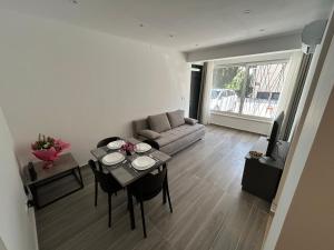a living room with a table and a couch at Makala Accommodation in Split +31 photos