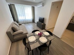 a living room with a table and a couch at Makala Accommodation in Split