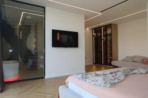 a living room with a couch and a table at Panorama Hill Villa Tirana - Private Pool & Views in Tirana