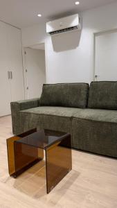 a living room with a couch and a coffee table at Palacios Centro - El Puerto in El Puerto de Santa María
