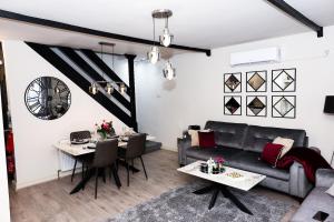 a living room with a couch and a table at Pasture Side House in Clayton