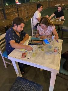a man and woman sitting at a table with a laptop at Nomaddicts in Mexico City +43 photos