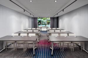 a room with tables and chairs and a window at Aloft by Marriott Miami - Brickell in Miami +45 photos