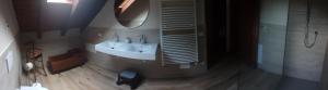 a bathroom with a sink and a mirror at Casa All'Angelo in Piovene Rocchette