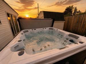 a hot tub sitting on top of a backyard at Ultimate Group Escape Heated Pool - 12 Guests in Parma