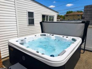a hot tub on the back of a house at Ultimate Group Escape Heated Pool - 12 Guests in Parma
