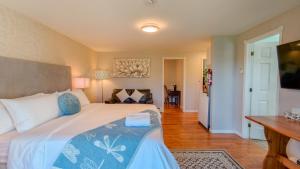 a bedroom with a bed and a living room at Lee's Ocean Peek B & B in Stratford