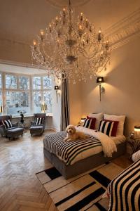 a dog laying on a bed in a bedroom at Sleephotels Alsterroom in Hamburg