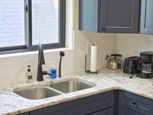 a kitchen counter with a sink and a window at Observer Ranch Campground & Learning Center in Penrose +146 photos