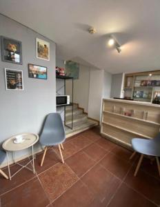 a waiting room with two chairs and a table at Svit home Hamster 007- apart-hotel in Lviv