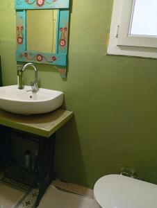 a bathroom with a sink and a toilet at Dal urla in Urla +11 photos