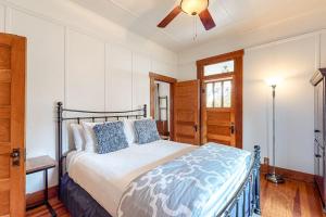 a bedroom with a bed and a ceiling fan at Enchanting Home with Fireplace, Full Kitchen, Patio, Central AC, & Washer/Dryer in Fredericksburg