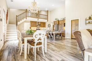 a dining room and kitchen with a table and chairs at Expansive Getaway Near Downtown with Fast WiFi, Grill in Fredericksburg +22 photos