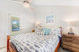 a bedroom with a bed and a dresser and a window at Two-Story Waterfront Retreat with Boat Dock, Two Firepits & Two Kayaks in Burnet