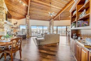 a living room with a couch and a table at Stunning Lakefront Home with 2 Patios, Chef's Kitchen, & Lake Access in Spicewood