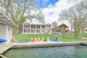 a house with chairs and a pool in front of it at Lakeside, Dog-Friendly Living with Kayaks, Boat Ramp, Pool Table & Ping-Pong in Kingsland