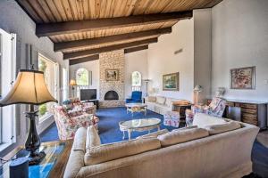 a living room with a couch and a table at Snowbird-Friendly House with Game Room, Full Kitchen, Balcony & W/D in Kerrville