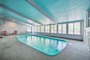 a large swimming pool in a room with a blue ceiling at Snowbird-Friendly House with Game Room, Full Kitchen, Balcony & W/D in Kerrville