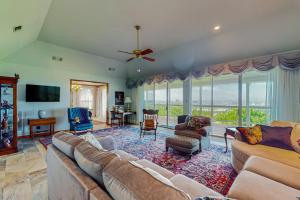 a large living room with a couch and a tv at 2-Story Home with Covered Patio, Balcony, Fireplace, Streaming, Great Views, W/D in Kerrville