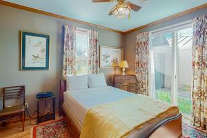 a bedroom with a bed and a window at 2-Story Home with Covered Patio, Balcony, Fireplace, Streaming, Great Views, W/D in Kerrville