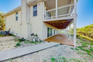 a large house with a wooden walkway in front of it at 2-Story Home with Covered Patio, Balcony, Fireplace, Streaming, Great Views, W/D in Kerrville