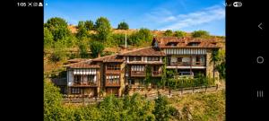a group of houses sitting on a hill at APARTAMENTOS LA COTERA sc in Cambarco