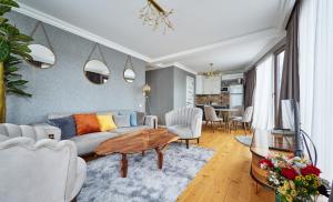 a living room with a couch and a table at 4Season Villa in Tbilisi City