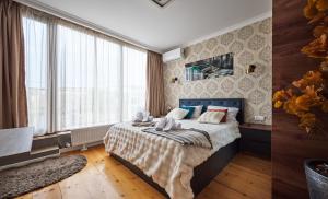 a bedroom with a bed with two towels on it at 4Season Villa in Tbilisi City