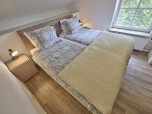 a large couch in a living room with a window at Spijk vakantiehuis in Spijk