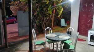 a table and chairs sitting on a patio at Microcasa Pousada Residencial Botânica com Kit Café da manhã in Itupeva +7 photos