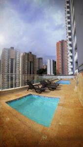two swimming pools on the roof of a building at Atardeceres de Sabaneta in Sabaneta