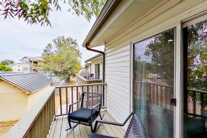 a balcony with two chairs on a house at Contemporary, Dog-Friendly Townhouse with Balcony, Pool & Day Docks in Horseshoe Bay