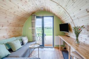 a living room with a couch and a tv at 1 Bed in Blairdrummond oc-b37875 in Doune