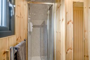 a shower with a glass door in a bathroom at 1 Bed in Blairdrummond oc-b37875 in Doune +11 photos