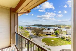 a balcony with a view of a street at Water-View Condo with Balcony, Smart TVs, Washer/Dryer and Pool in Horseshoe Bay