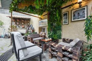 a patio with two chairs and a table at 4Season Villa in Tbilisi City