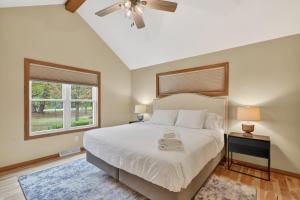 a bedroom with a bed and a ceiling fan at Cottage on the Hill in Ephraim