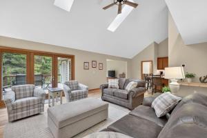 a living room with a couch and chairs at Cottage on the Hill in Ephraim +45 photos