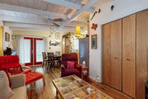 a living room with a couch and a table at Cozy Dog-Friendly House Near Water with Enclosed Yard, Grill, & Equipped Kitchen in Burnet