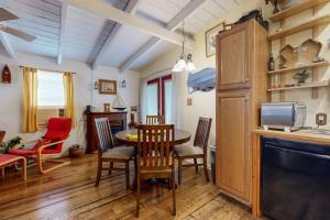 a kitchen and dining room with a table and chairs at Cozy Dog-Friendly House Near Water with Enclosed Yard, Grill, & Equipped Kitchen in Burnet