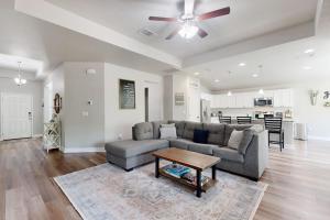 a living room with a couch and a table at Cozy Lago Vista Home with Private Pool Table, Mile From The Stunning Lake Travis in Lago Vista