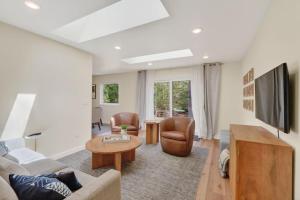 a living room with a couch and a table at Maevebrook in Sister Bay
