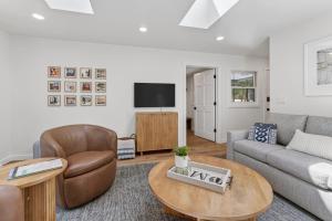 a living room with a couch and a table at Maevebrook in Sister Bay