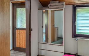 a room with a door and a mirror in a room at Amazing Home In Meschede With Wifi in Meschede