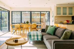 a living room with a couch and a table at Perfect Beachside Escape - Walk Everywhere in Anglesea