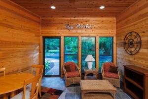 a dining room with a table and chairs at Asher Manor by Simple Life Rentals in Egg Harbor