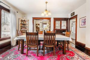 a dining room with a table and chairs at Stowaway Lower Deck in Sturgeon Bay